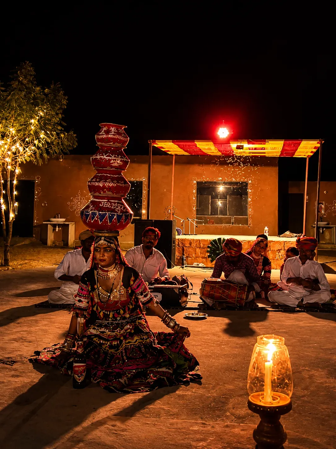 Rajasthani Bhavai folk artist performing pot balancing live with candle illumination