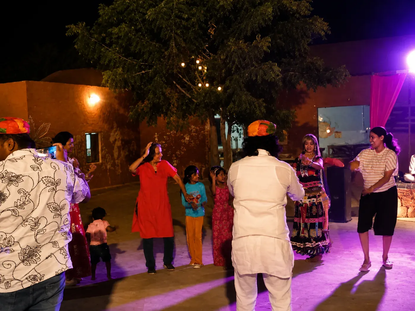 Camp guests participating in evening Rajasthani group dance