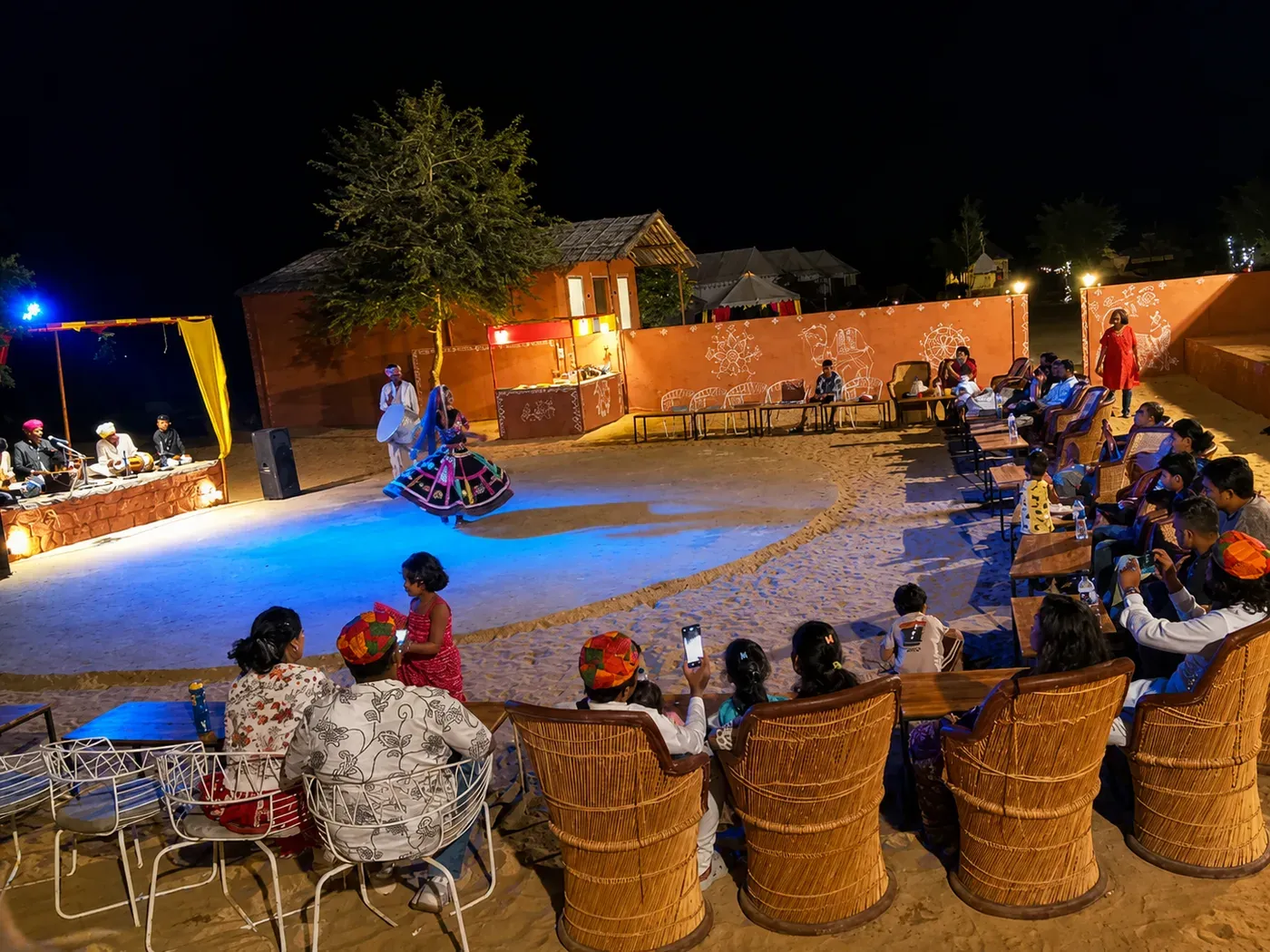 Kalbelia folk dancer performing in the open-air desert camp arena