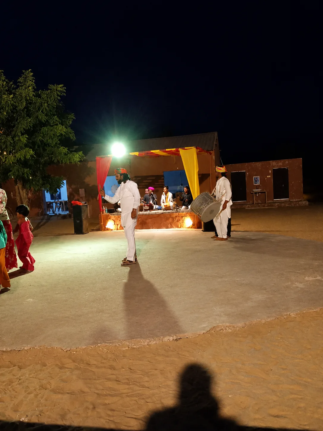 Rajasthani folk musicians and dholak percussionist performing on stage