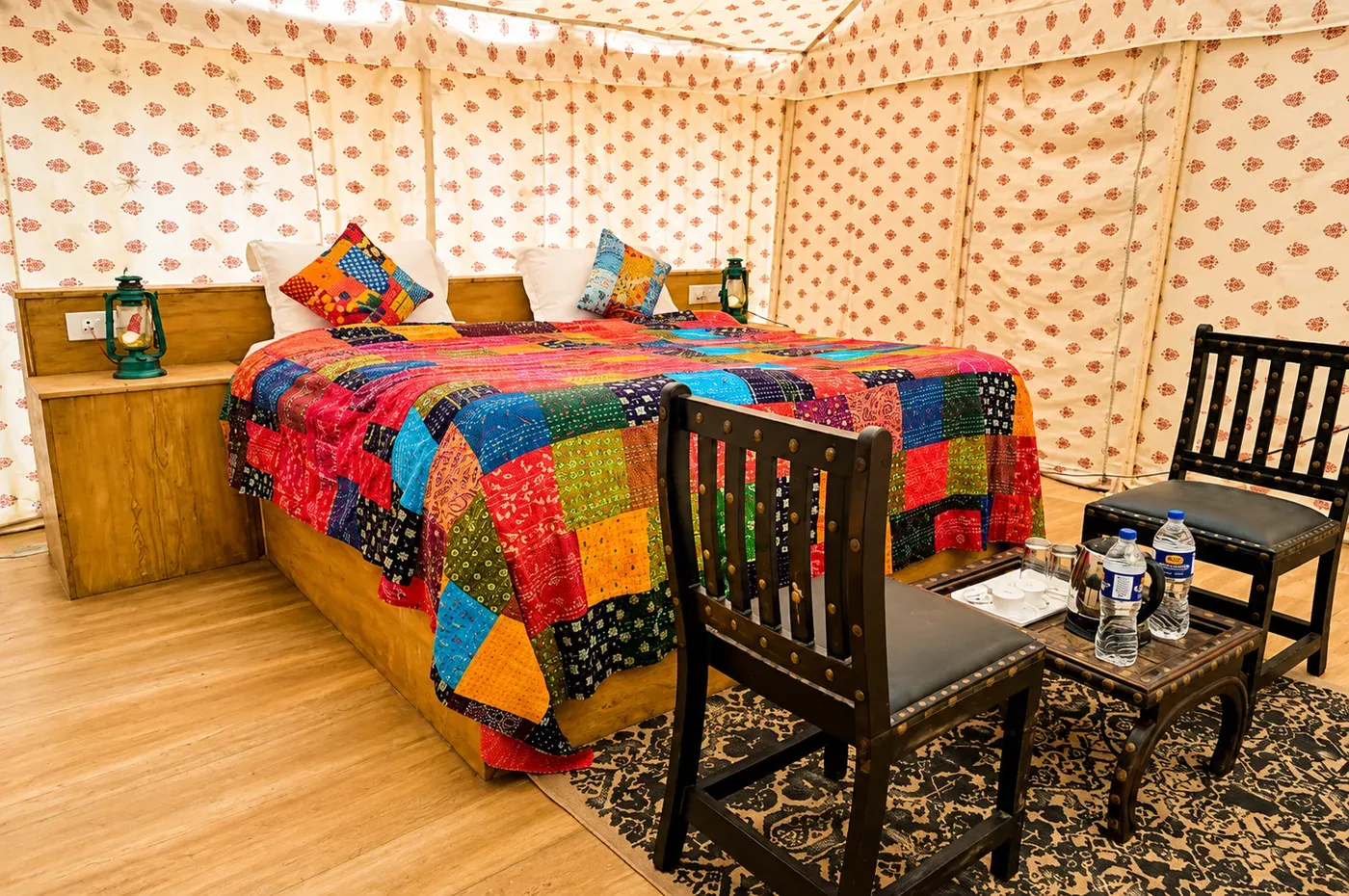 Deluxe Swiss Tent bedroom and sitting area